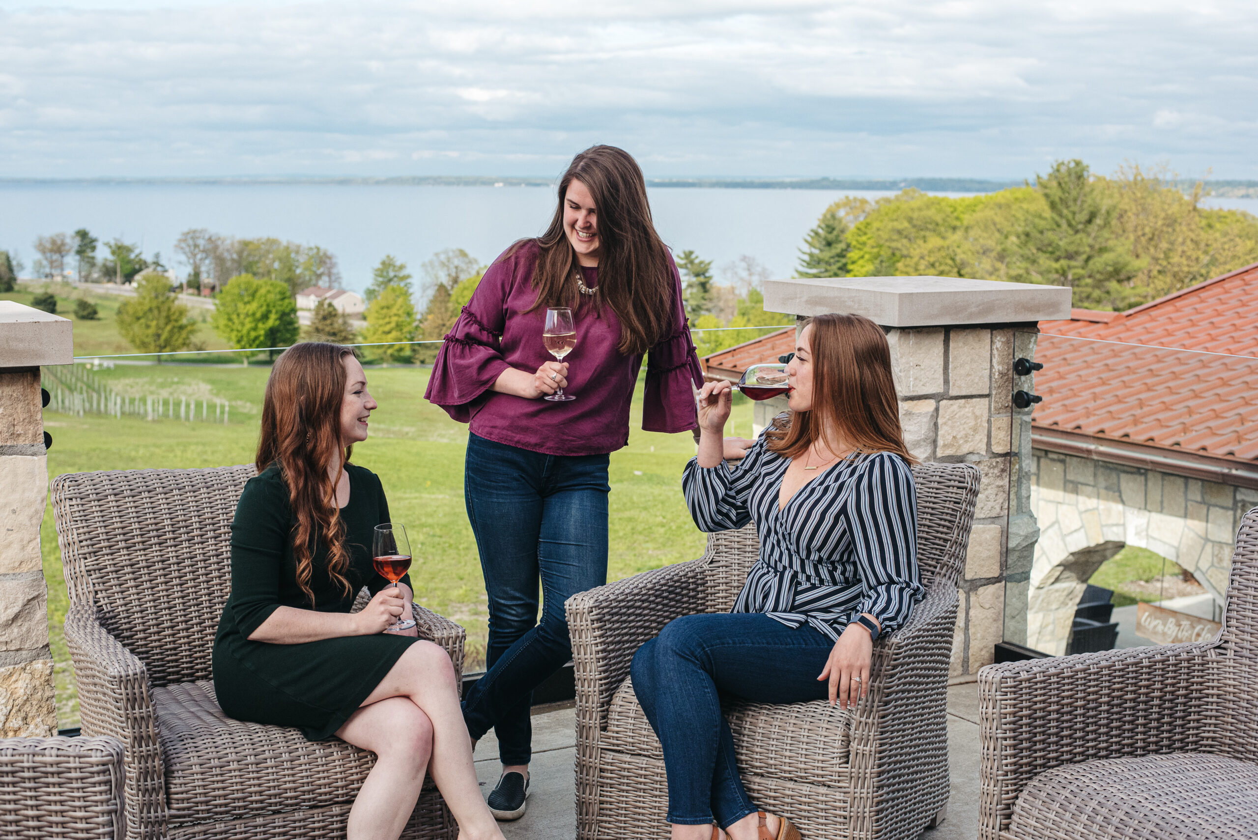 Woman drinking wine by the fire